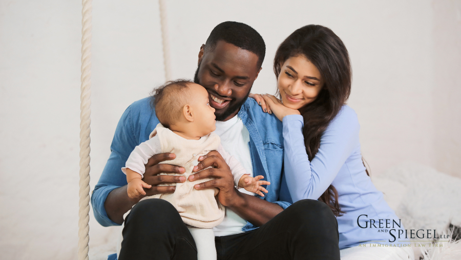 Two parents holding baby, Second-Generation Canadian Citizenship