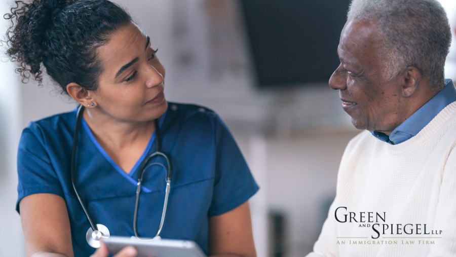 Long-Term-Care-Home employee conversing with resident.