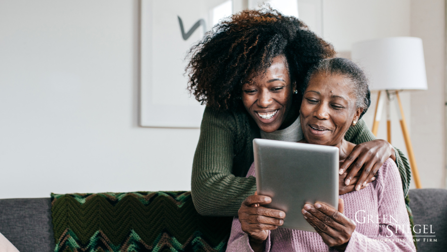 Woman with caregiver looking at tablet. Canada’s Caregiver Programs: Expectations and Questions for the Future