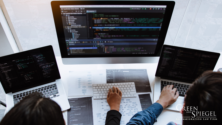 Workers on computer, Canada tech immigration pathways